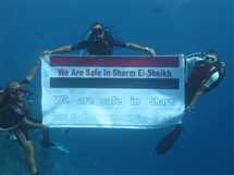 حملة «شرم الشيخ آمنة» تواصل فعالياتها.. وغطاسون يحملون أعلام مصر تحت الماء